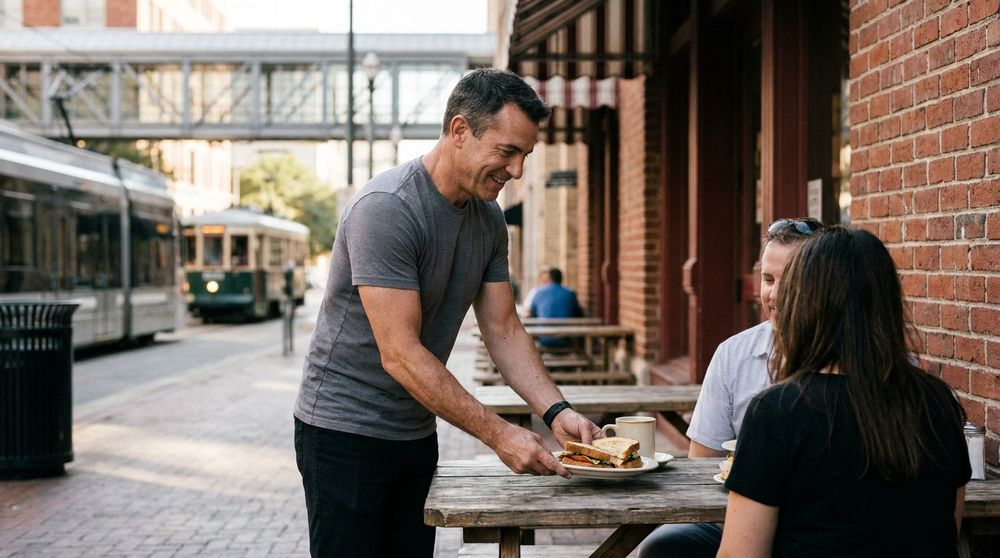 cafe owner serving customers on a downtown plano sidewalk patio